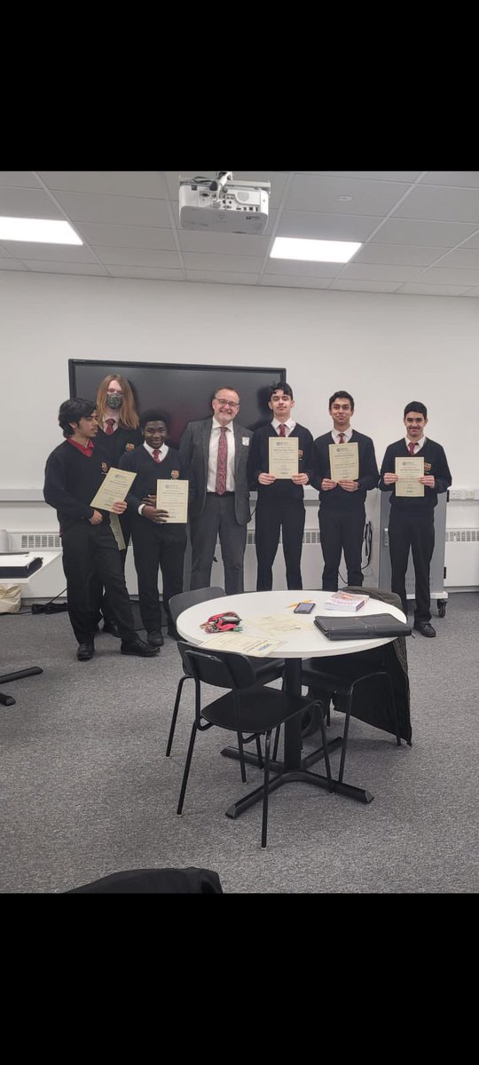 Fitzalan_NSA's tweet photo. Congratulations to the Fitzalan pupils celebrating their Physics Olympiad success. Thanks to Leo Ball for awarding their certificates. #Gold # Bronze @Seren_Network @Fitzalan_6form @NetworkSeren https://t.co/hF6QoIrzqB