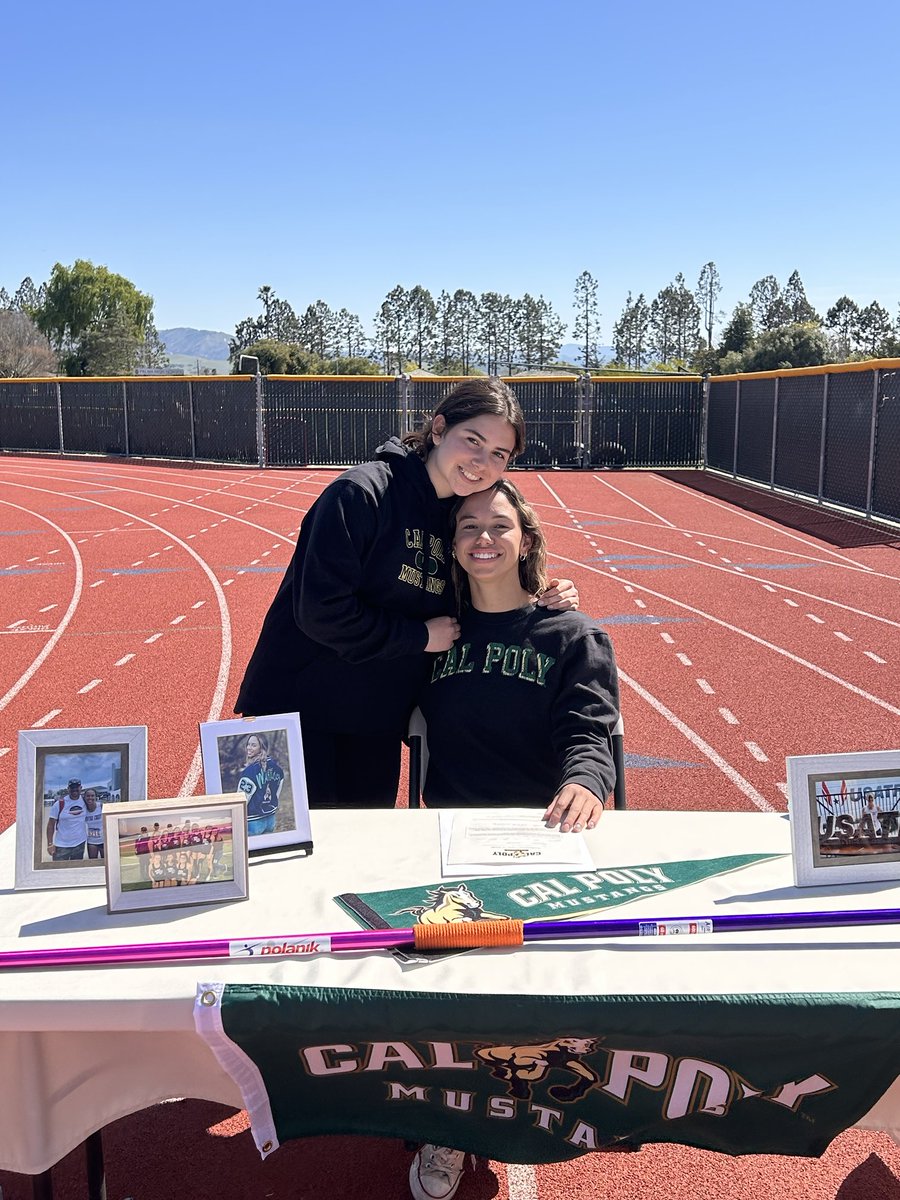 martinez_coach's tweet photo. Bella and Maya embrace for Bella signing her Letter of Intent to run Track at Cal Poly. https://t.co/dzbsr9oMWd