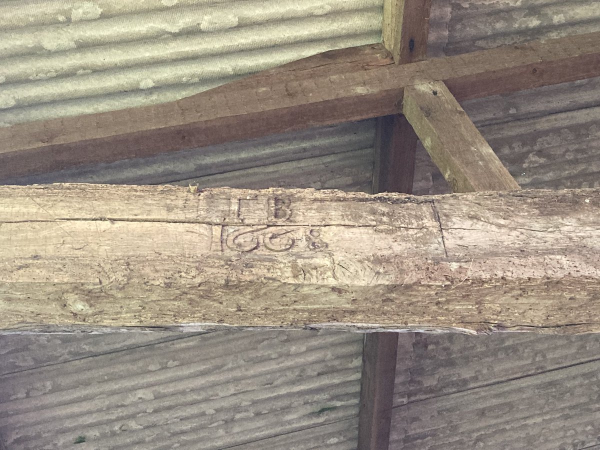 henryspil's tweet photo. This ramshackle barn in rural West Oxfordshire hides an ancient secret - an oak beam with carved initials ‘TB’ and dated 1668 https://t.co/jNFIt3pEyC