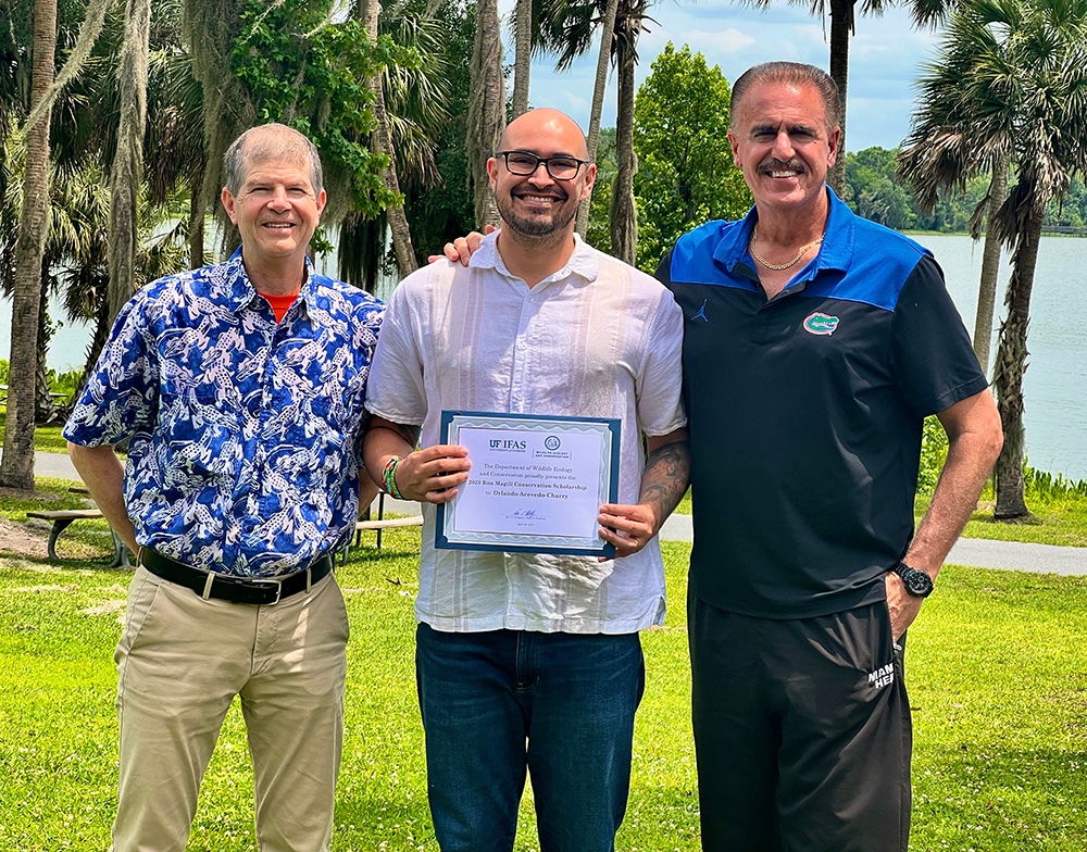 Very proud to present the annual 'Ron Magill Conservation' $5,000 scholarship to UF PhD student, Orlando Acevedo-Charry, to support his amazing work on bird diversity in Colombia! Also pictured, is Wildlife Ecology & Conservation Department Chair, Dr. Eric Hellgren. Go Gators!