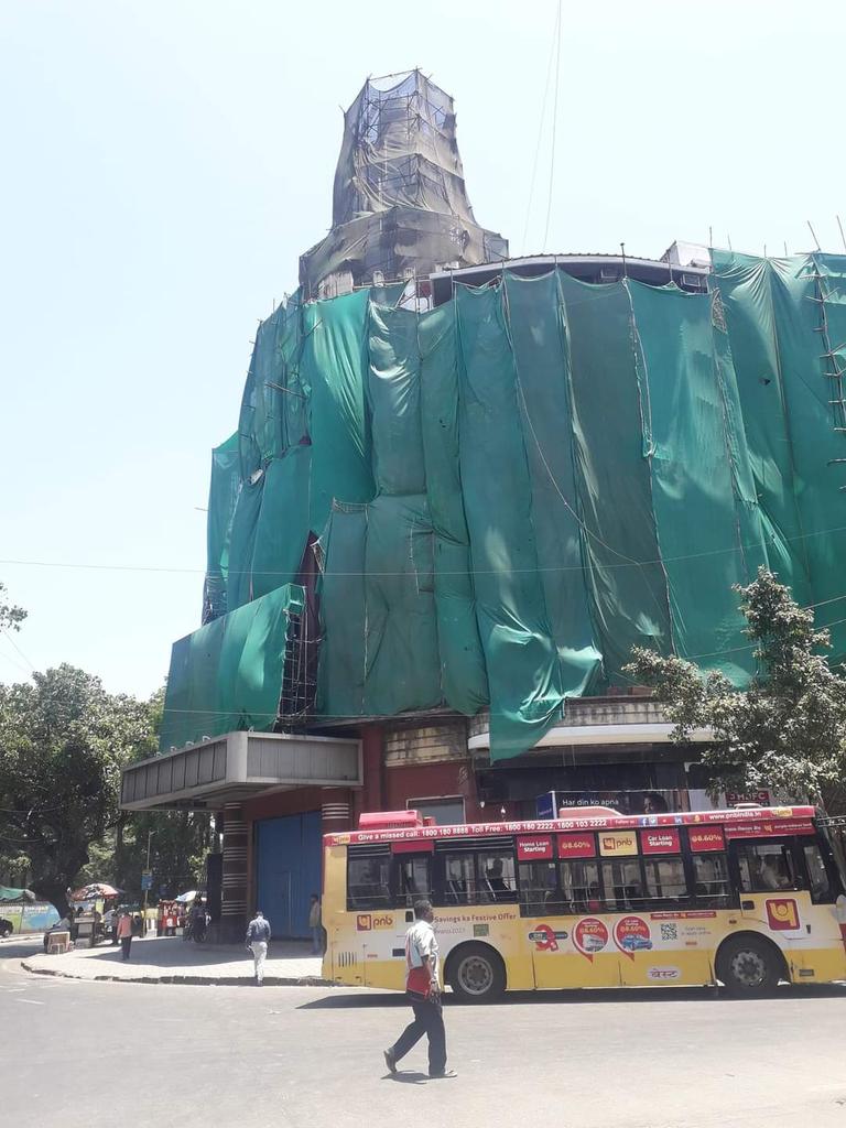 vibione's tweet photo. Eros Cinema in Bombay being torn down. There is something terribly wrong with govt bodies in Bombay. A bastion and prime example of Art Deco. It will be replaced with a shiny glass and chrome mall like any other in the world. Sad day. https://t.co/cXoUb76clG