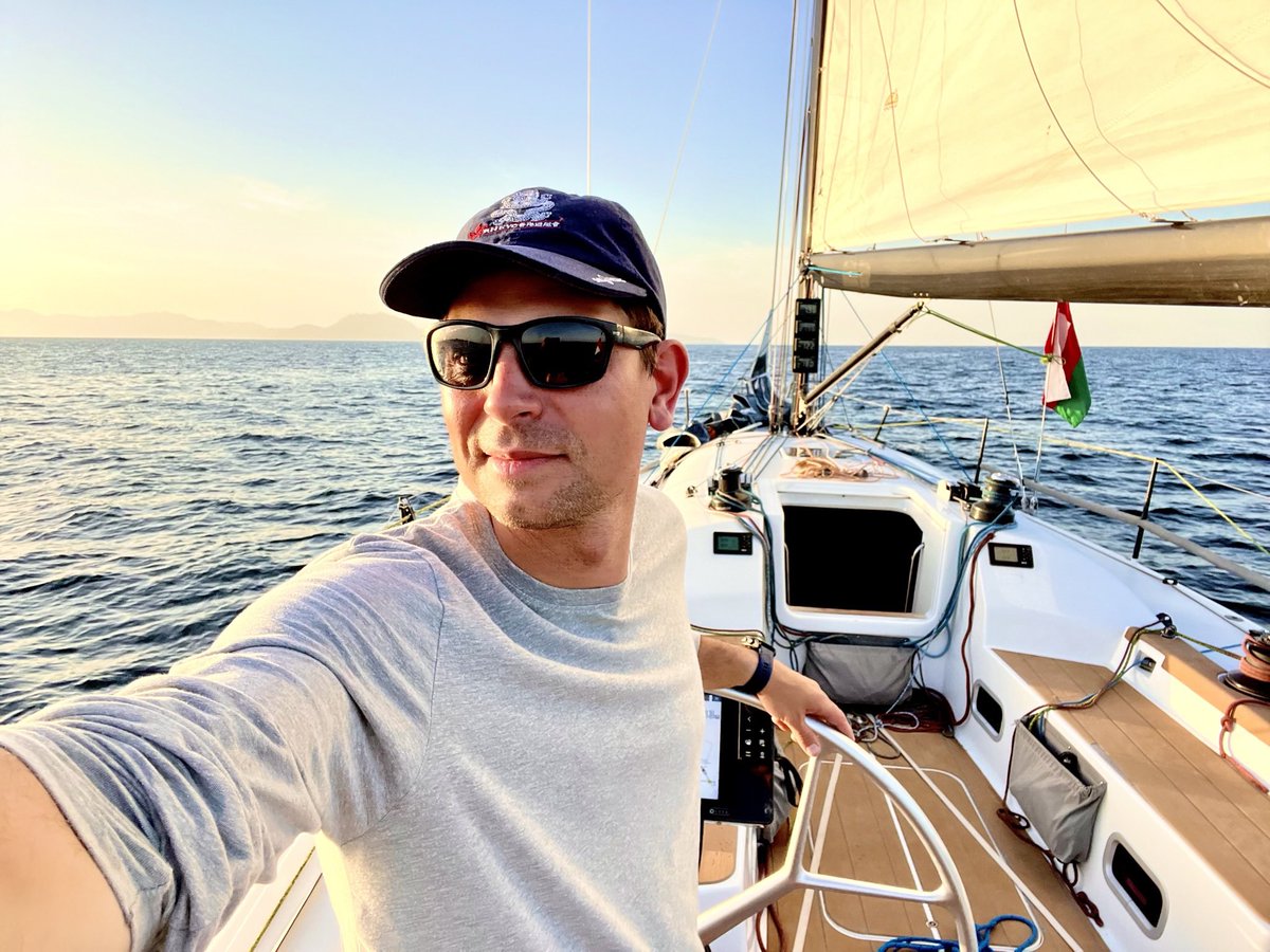 As I sail through the Gulf of Oman, I can't help but reflect on the similarities between sailing and entrepreneurship. What can we learn about taking risks and navigating through unfamiliar waters?

Here I am, wearing my Royal Hong Kong Yacht Club cap with pride, as a part of the