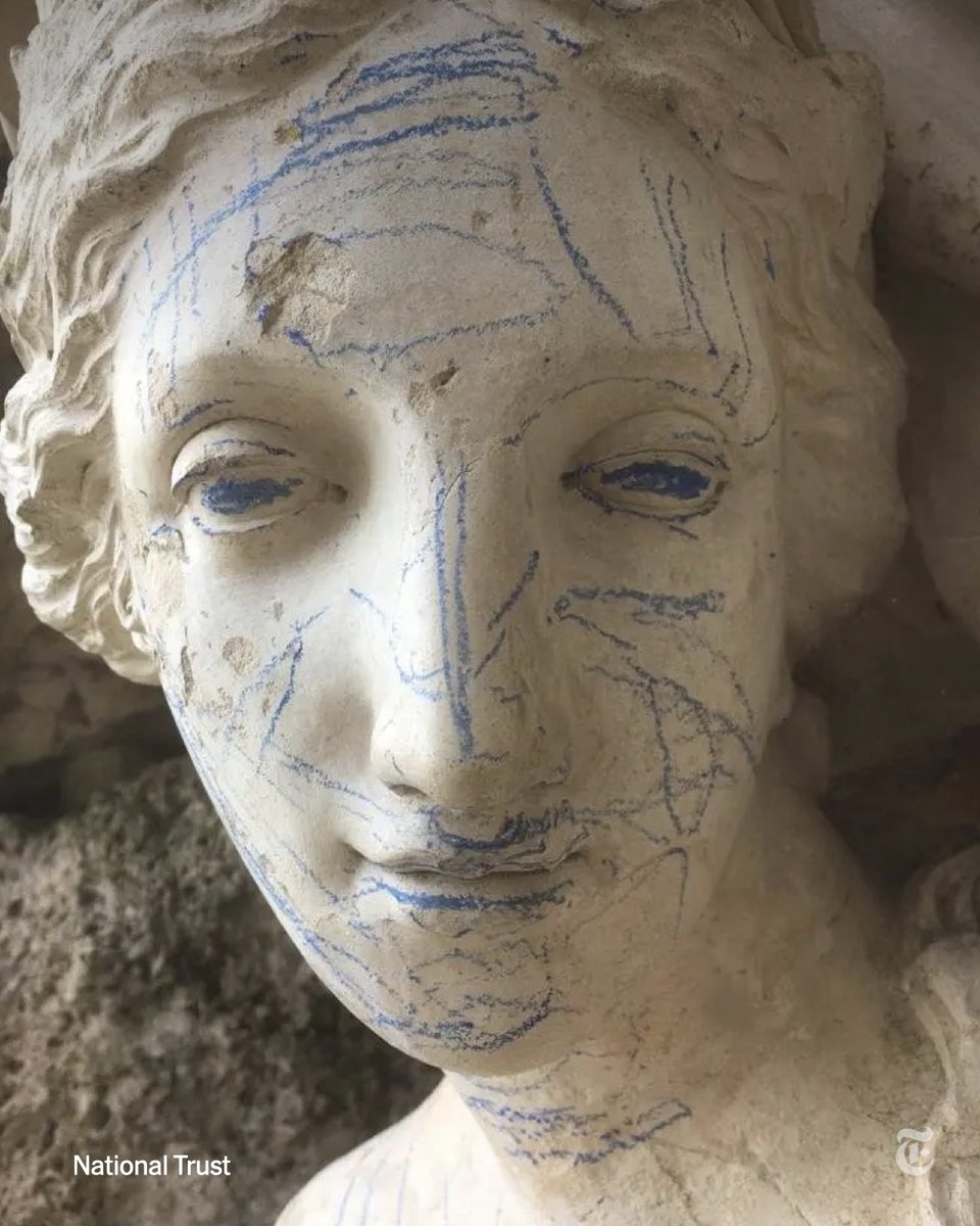 nytimes's tweet photo. Bright blue crayon marks were found on a statue that is more than two centuries old at a conservation site in England after crayons were handed out to children at the property, officials said. The statue and a memorial were defaced this month. https://t.co/RTXlcNR7v8 https://t.co/eT57zERhS1