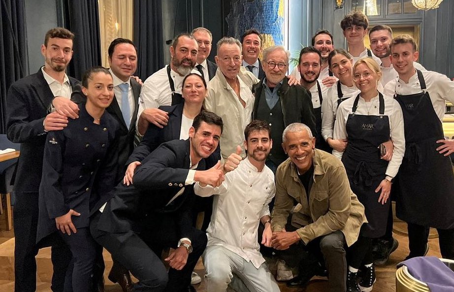 MikeSington's tweet image. President Obama, Steven Spielberg, and Bruce Springsteen have dinner together at a restaurant in Barcelona, then pose for a picture with the delighted staff.