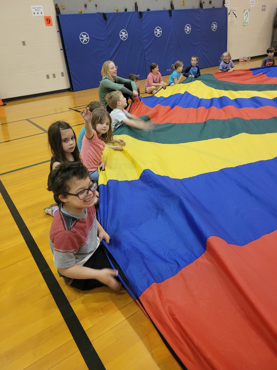 AlyssaFelts93's tweet photo. Parachute day in P.E. is the best not only for the kids but the adults too! I had so much fun reliving memories and making new memories with students yesterday. I had never played Sharks with the parachute, but the kids made sure Mrs. Alyssa was included in their fun! #weare409 https://t.co/gjYrcYdgH3