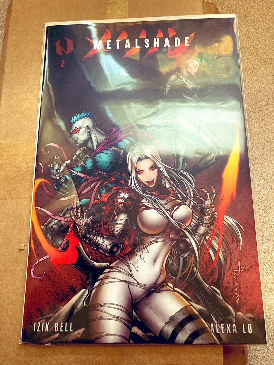 HellsSpawnWorld's tweet photo. Yesterday the mail man dropped this off for me. A copy of #MetalShade 1,2 & 0. By my buddy @insidious_izik and his lovely partner #AlexaLo. I normally don’t do Kickstarter but for their art I had to. #indiecomics #comics #IronAge #ComicsGate #comicbooks #WeWillWin #RippaVerse https://t.co/F02VgVg0J8