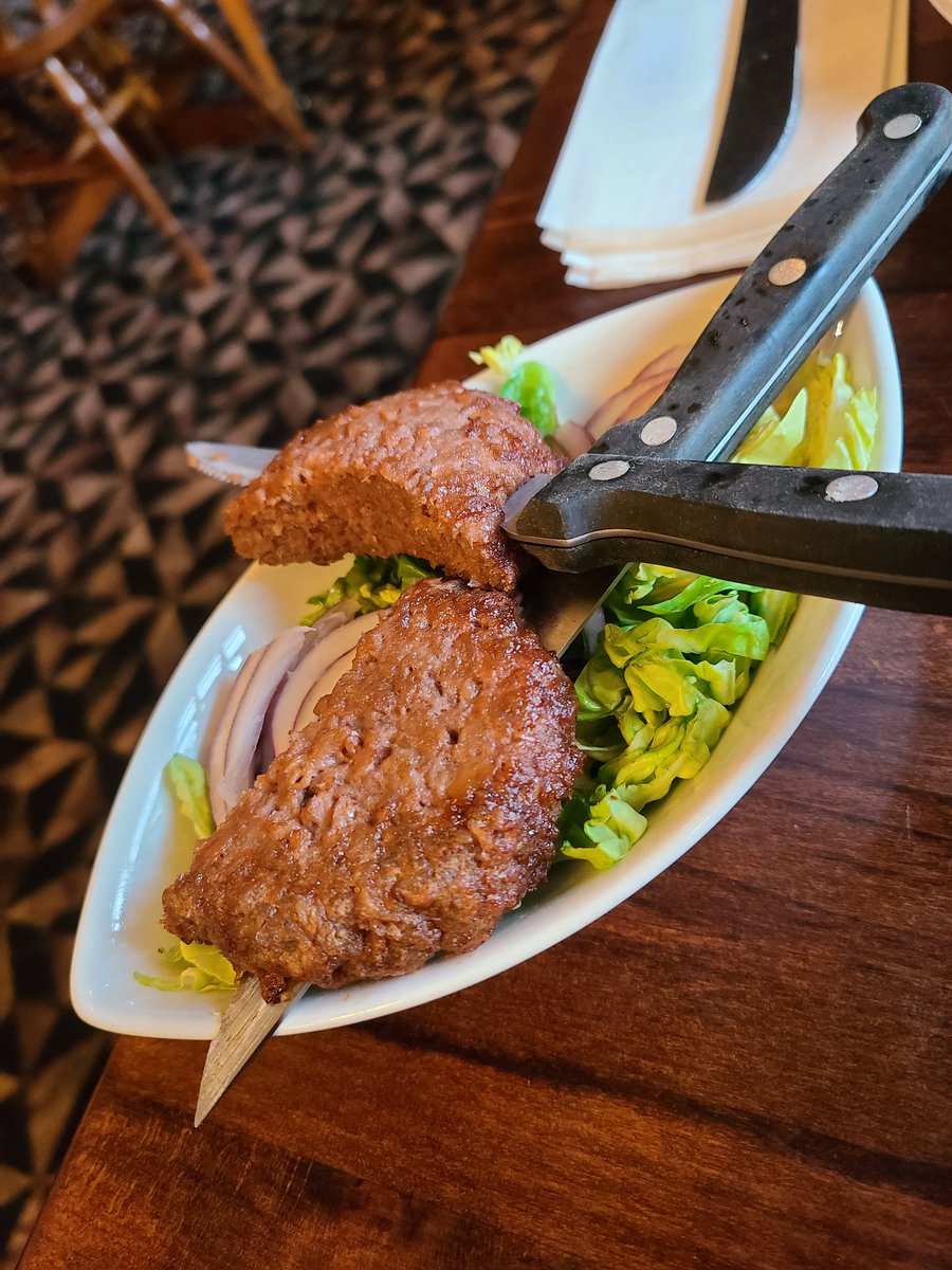 DanHenstone's tweet photo. Plant based skewers @greeneking this a just a burger stabbed by a knife? Is this the usual standard for vegans? https://t.co/9p3sKbNRJl