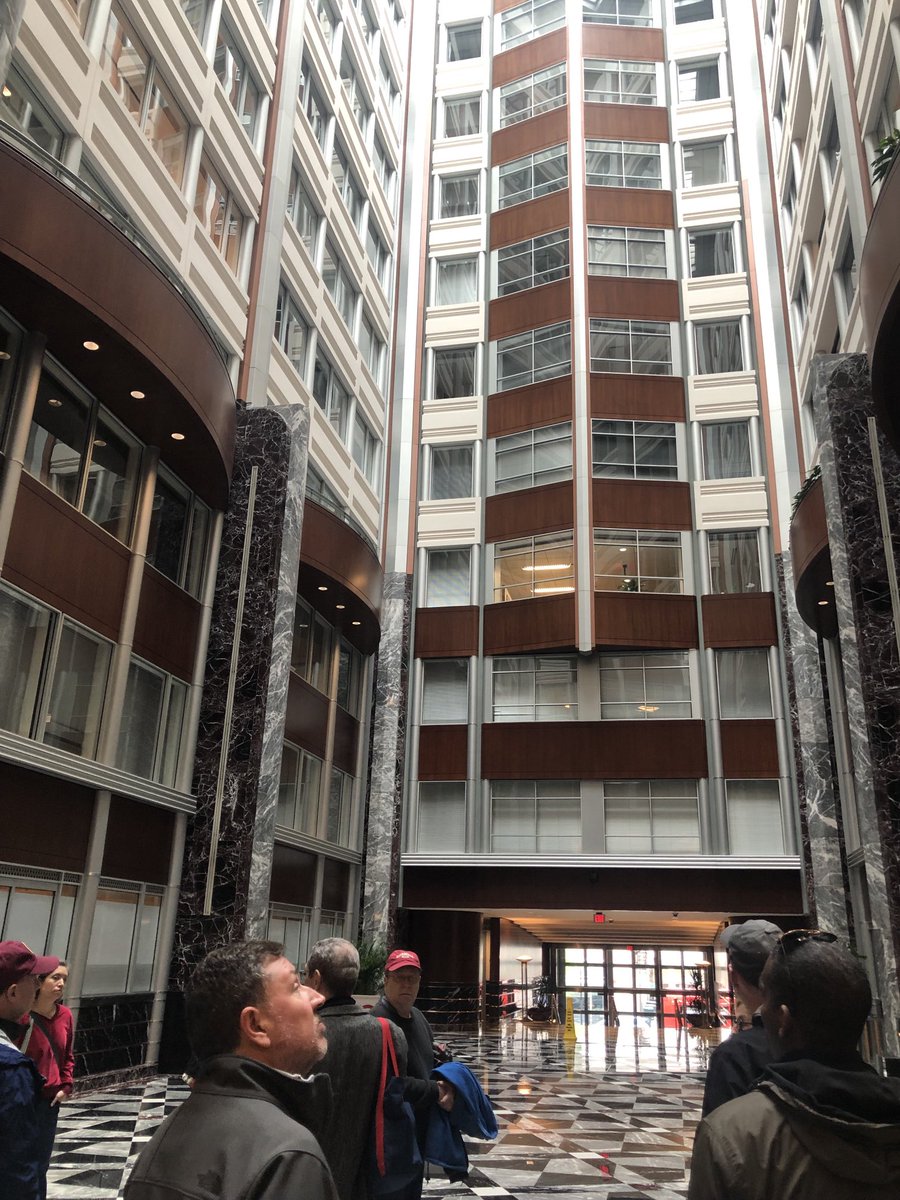 WashingtonWalks's tweet photo. Evidence of how a 1940s bus terminal influenced the design of this soaring atrium in a 1991 office building. Thanks architect Phil Esocoff for leading a walking tour that took us inside 1100 New York Avenue!  #DCArchitecture #HistoricPreservation #ArtDeco https://t.co/8JjvENRFCd