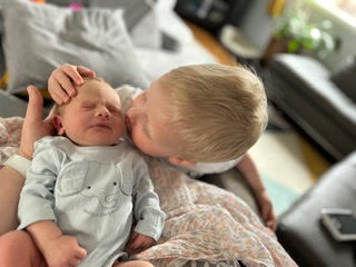 YegHealth's tweet photo. Big news at our clinic.  We are so excited to announce that Amy had her baby.  Here is Holly!! And her big brother couldn't be happier! https://t.co/caWC7pESv5