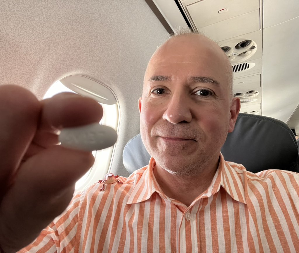 RickGuasco's tweet photo. Taking my #HIV medication at 30,000 feet. #normalizeHIV https://t.co/F677t01gud
