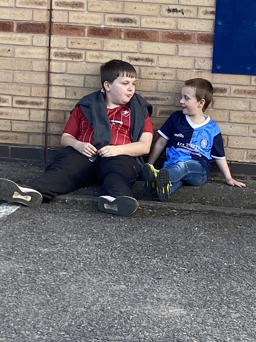 simply_Kelly84's tweet photo. When its all said and done. This is what football is all about. Two lads sat outside chatting and giggling, not giving two hoots about the score. Not worried about what team they support, or where they're from . Just two boys talking football. @CTFCofficial @wwfcofficial https://t.co/NgHduFsKiL