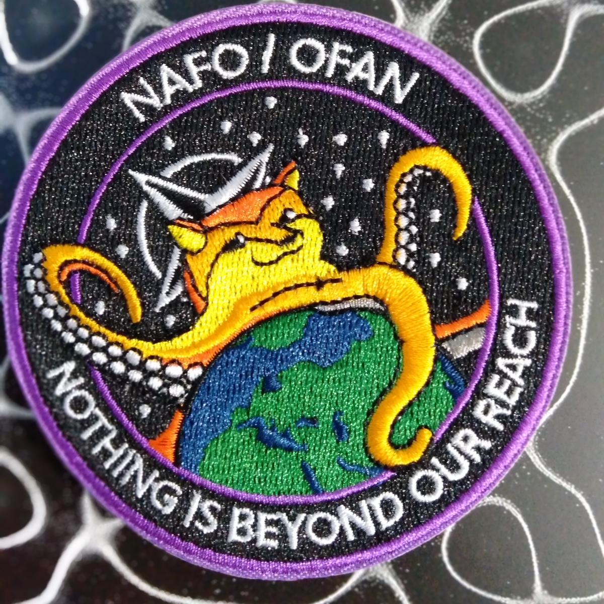 davidevans442's tweet photo. @Official_NAFO These patches are just AWESOME, really nicely made and colourful. Here's mine, resplendent with background from a recent NODE album: https://t.co/gOAqcyIR2U