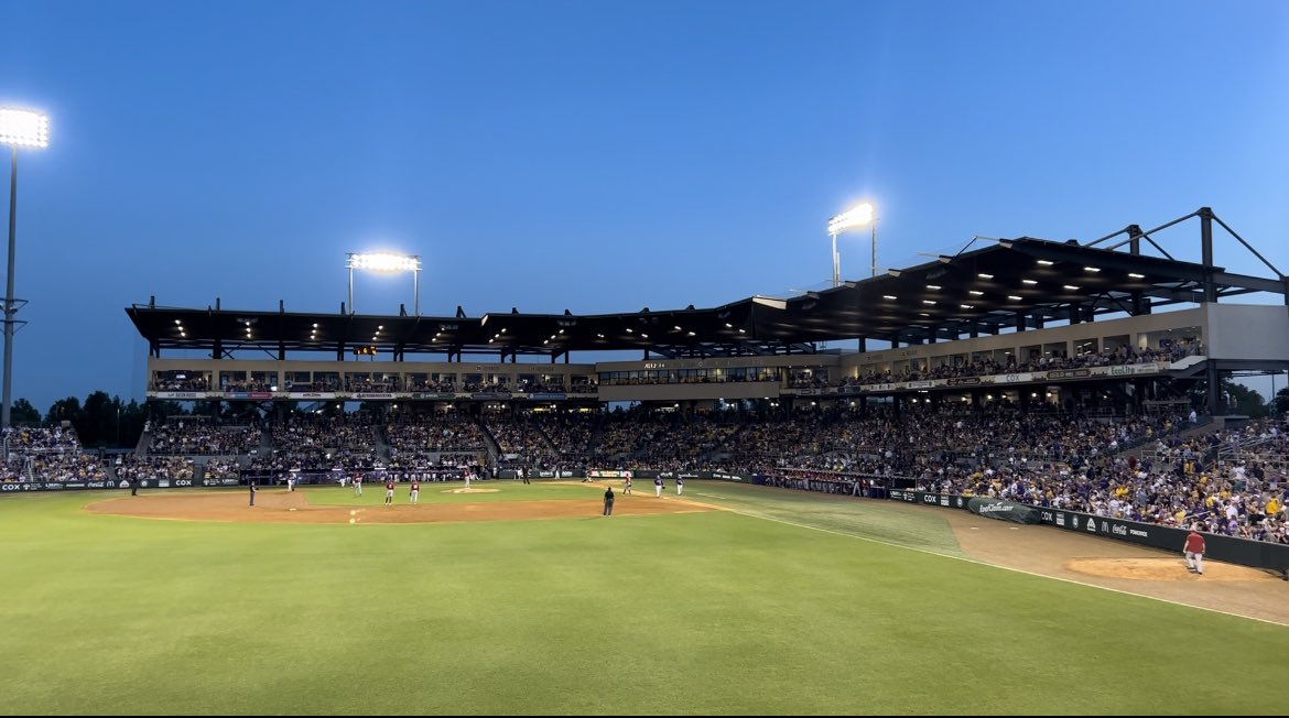 BySteveHolley's tweet photo. Anyway, baseball is beautiful, spring is wonderful, and I’m fortunate to live near one of the most incredible college campuses in the country. Come say hi if you’re near the left field bleachers tonight. #LSU #AlexBoxStadium https://t.co/2BedMYcOET