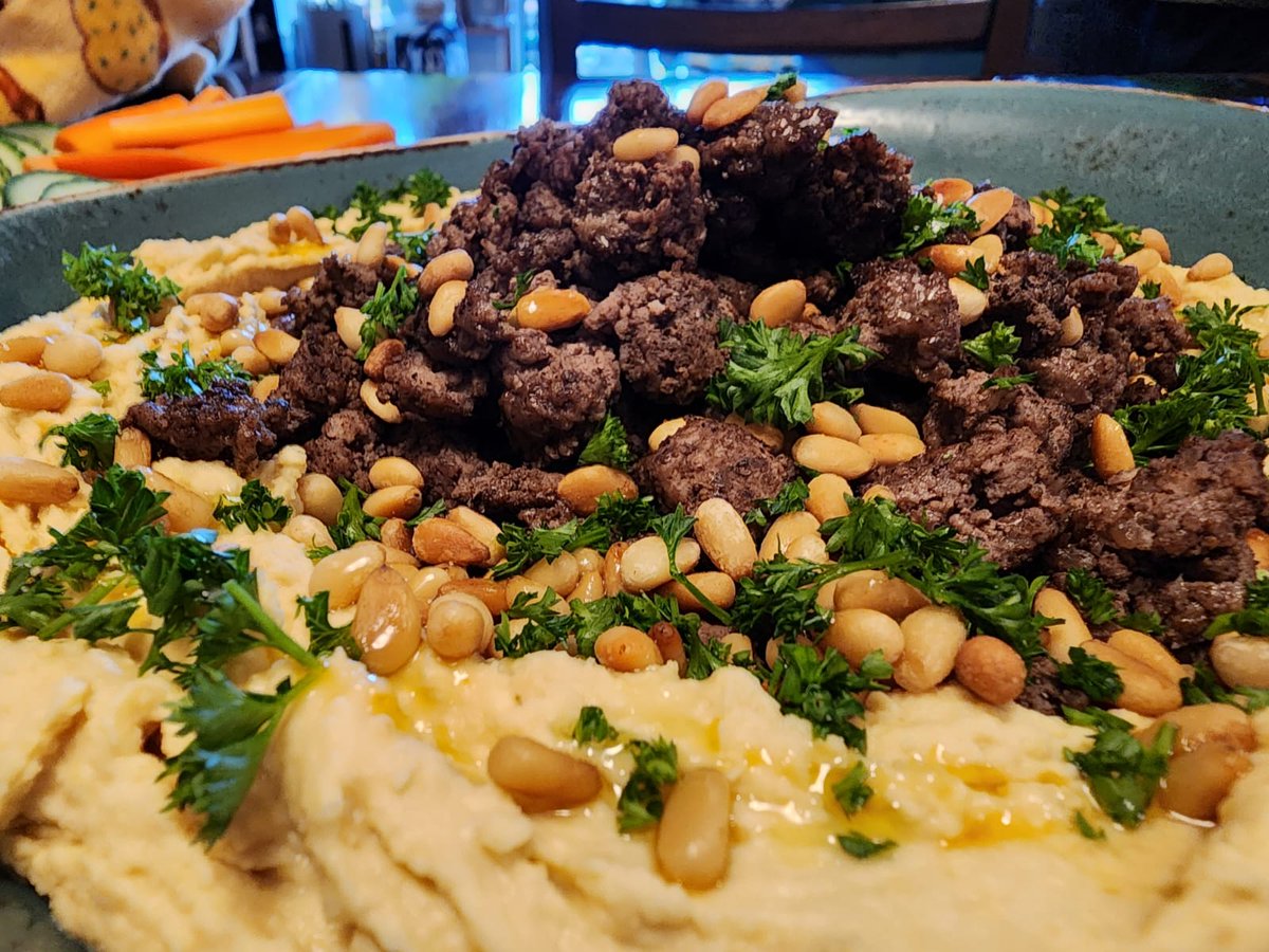 Hummus with ground beef, pine nuts, parsley and chili oil, served with assorted dippers.