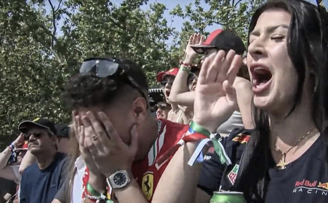 Formuladream1's tweet photo. A Ferrari fan and a Red Bull fan watching Leclerc lose the lead of the Azerbaijan Grand Prix https://t.co/Qopz7d9q6c