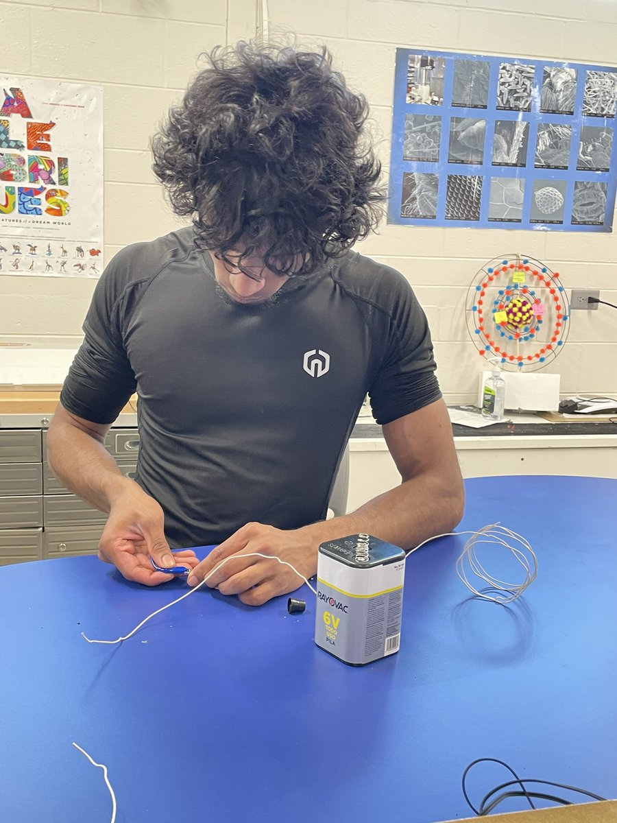 CompassD303's tweet photo. Students in the Electrochemistry seminar researched the relationship between electricity &amp; magnetism. Then, using wire, bolts, &amp; an electricity source, they created a magnet. By combining 3 magnets, one group was able to pick up a 5-lb. metal bar. #InquiryEd #STEM https://t.co/No7atYepHn