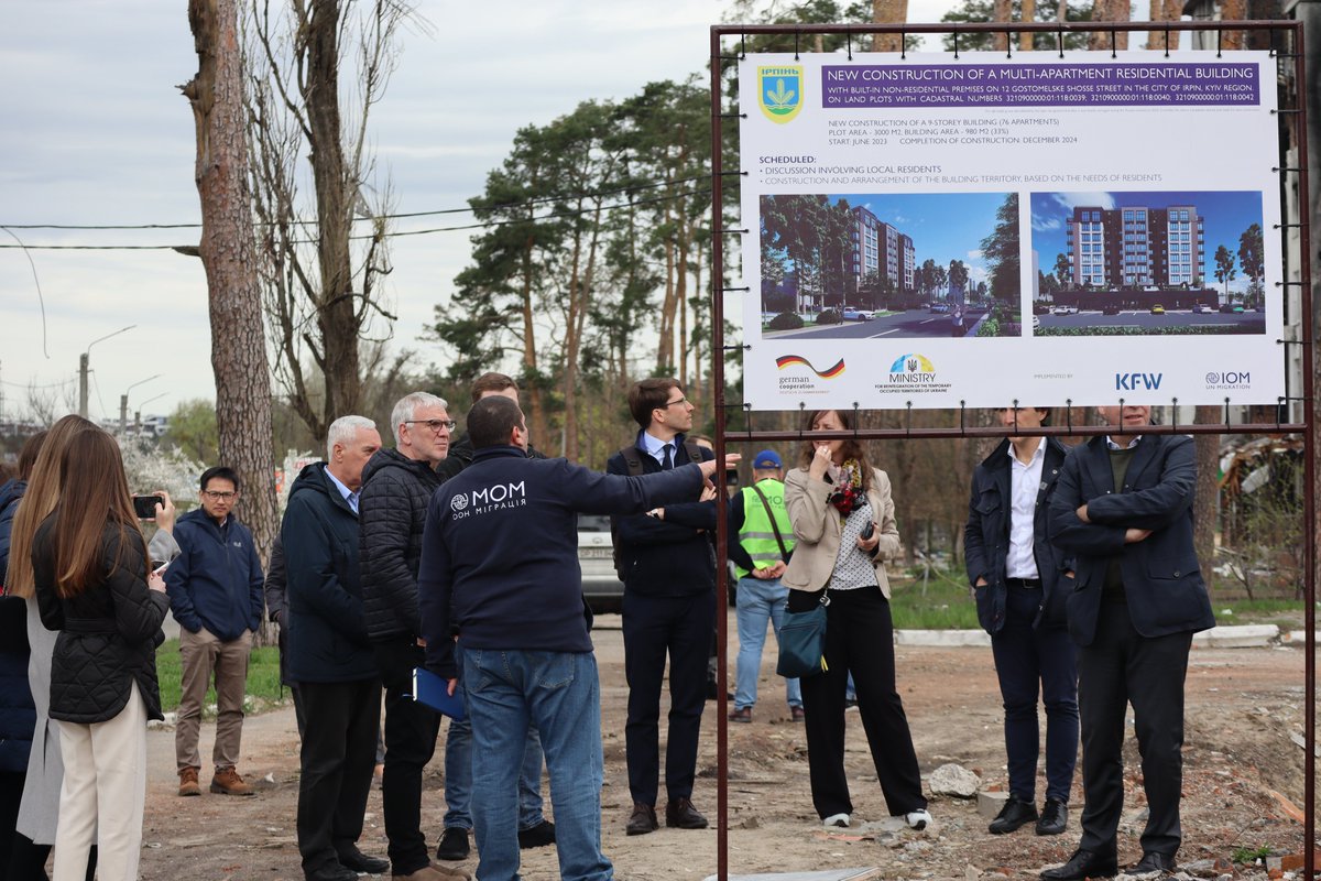 IOMUkraine's tweet photo. IOM is about to start a construction of a 9-story apartment building in Irpin to replace a demolished one, irreparable after the shelling. @JochenFlasbarth  visited the site to discuss how @BMZ_Bund can support recovery efforts in 🇺🇦 and create conducive conditions for return. https://t.co/9dj2tb13kf