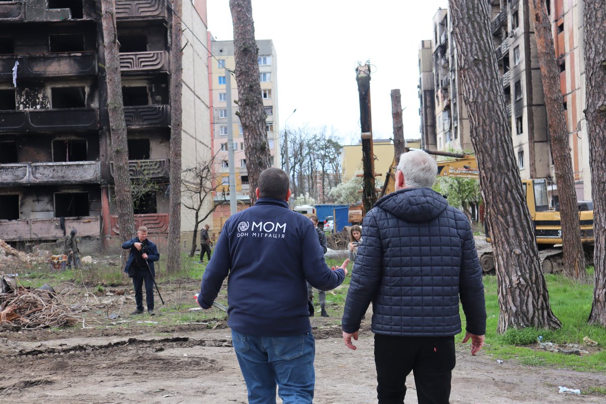 IOMUkraine's tweet photo. IOM is about to start a construction of a 9-story apartment building in Irpin to replace a demolished one, irreparable after the shelling. @JochenFlasbarth  visited the site to discuss how @BMZ_Bund can support recovery efforts in 🇺🇦 and create conducive conditions for return. https://t.co/9dj2tb13kf