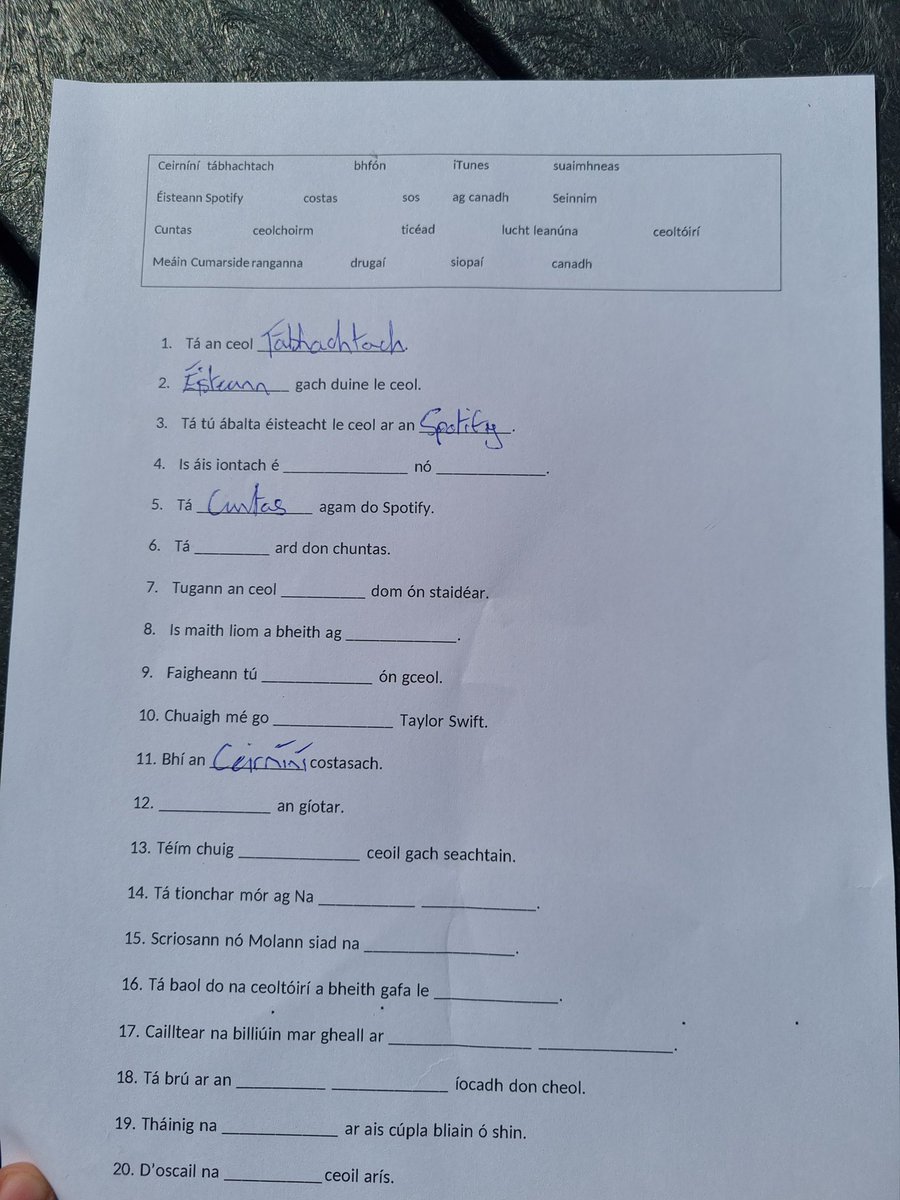 OideStacy's tweet photo. Bliain 3 - preparing for written exam question on Music. Filling in the blanks in the sun 🌞 
@Kingswoodcc16 @ddletb @ForasnaGaeilge https://t.co/ZZXGJxfn2U