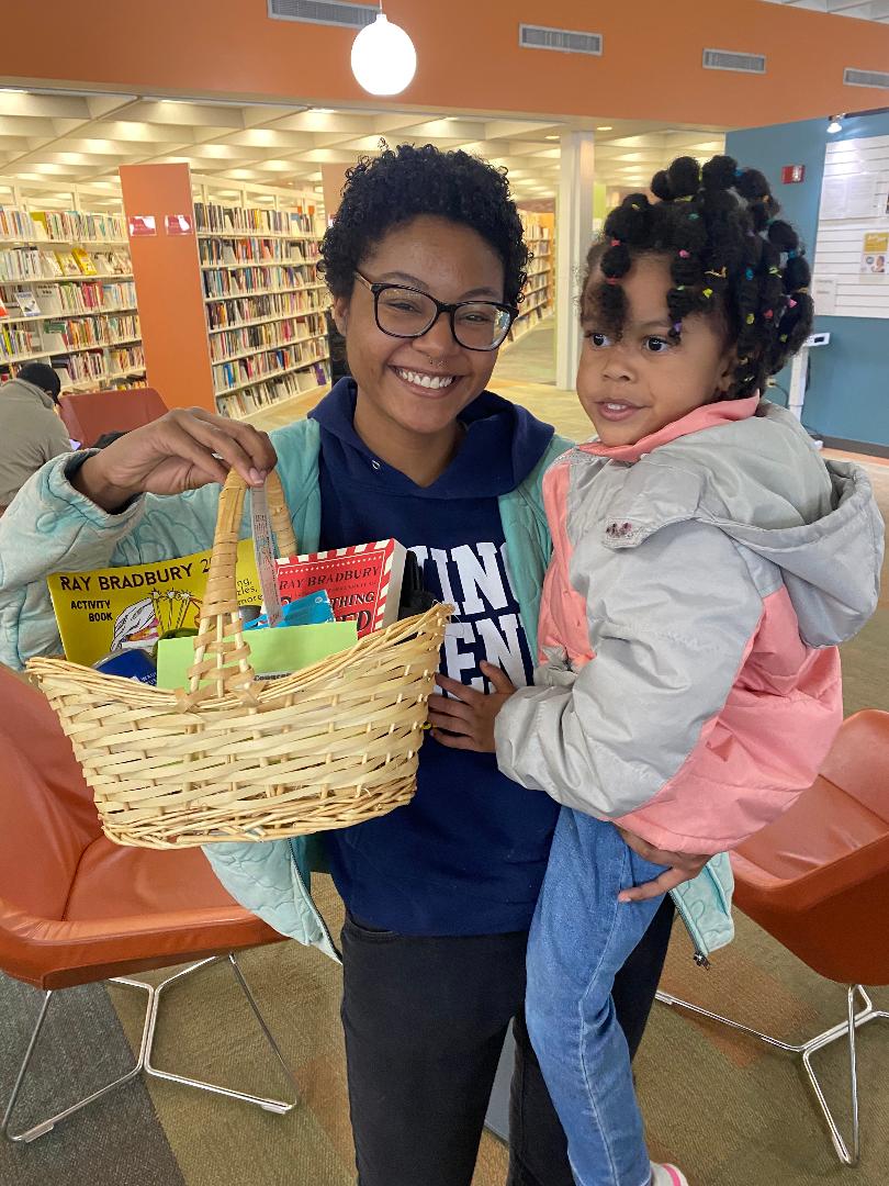 RBEMuseum's tweet photo. This is Xelina A. with her mom. She was 1 of 3 winners of Bradbury gift baskets during the recent Explore Ray Bradbury event at the Waukegan Public Library. We're sure that Xelina will appreciate Ray's stories in the years to come. ;-) The other winners were Elijah R. &amp; David S. https://t.co/5zgeNs7eG0