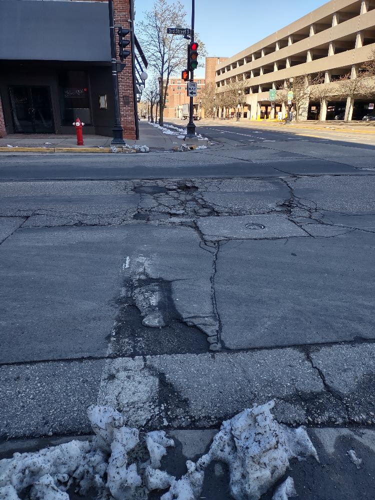 LaXWIForTransit's tweet photo. Thank you @aarpwi &amp; @IntrinsicPaths for a great and eye-opening walk today. We CAN have safe, healthy, quiet, pleasant streets for all ages &amp; abilities &amp; accessible public transit IF we insist. Let's start with #POTHOLES by the Transit Ctr (yes, THAT again!) #Bike/Ped>cars https://t.co/3DyyHMHUbj