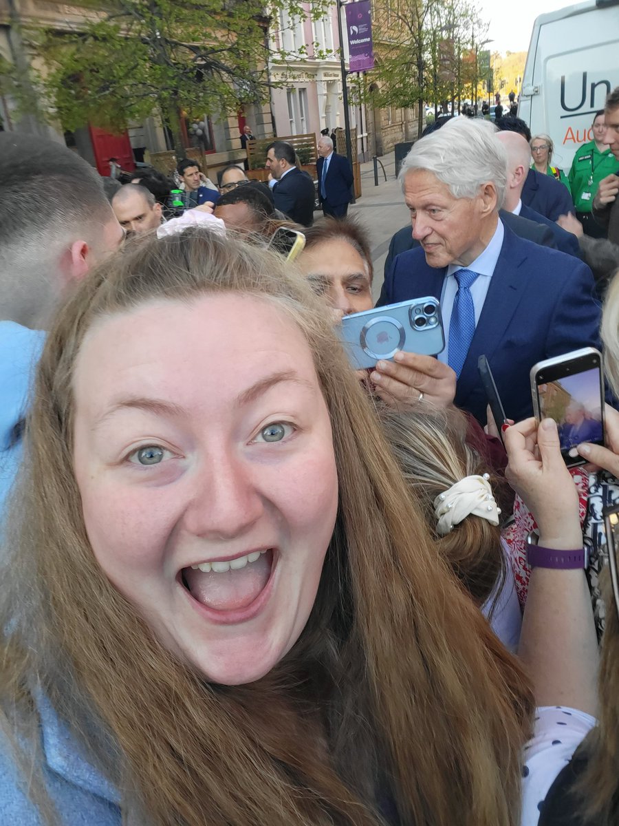 Laura_Paddy1991's tweet photo. 25 years ago at The Guildhall I was there, as a 4 year old girl, with my parent to see @BillClinton and his Peace Agreement speech. 25 years later we return to celebrate again. And he doesn't know it ... but we got a selfie together .... Kind of. 🙈🤣 #GoodFridayAgreement #Peace https://t.co/Mop9lBBHoO