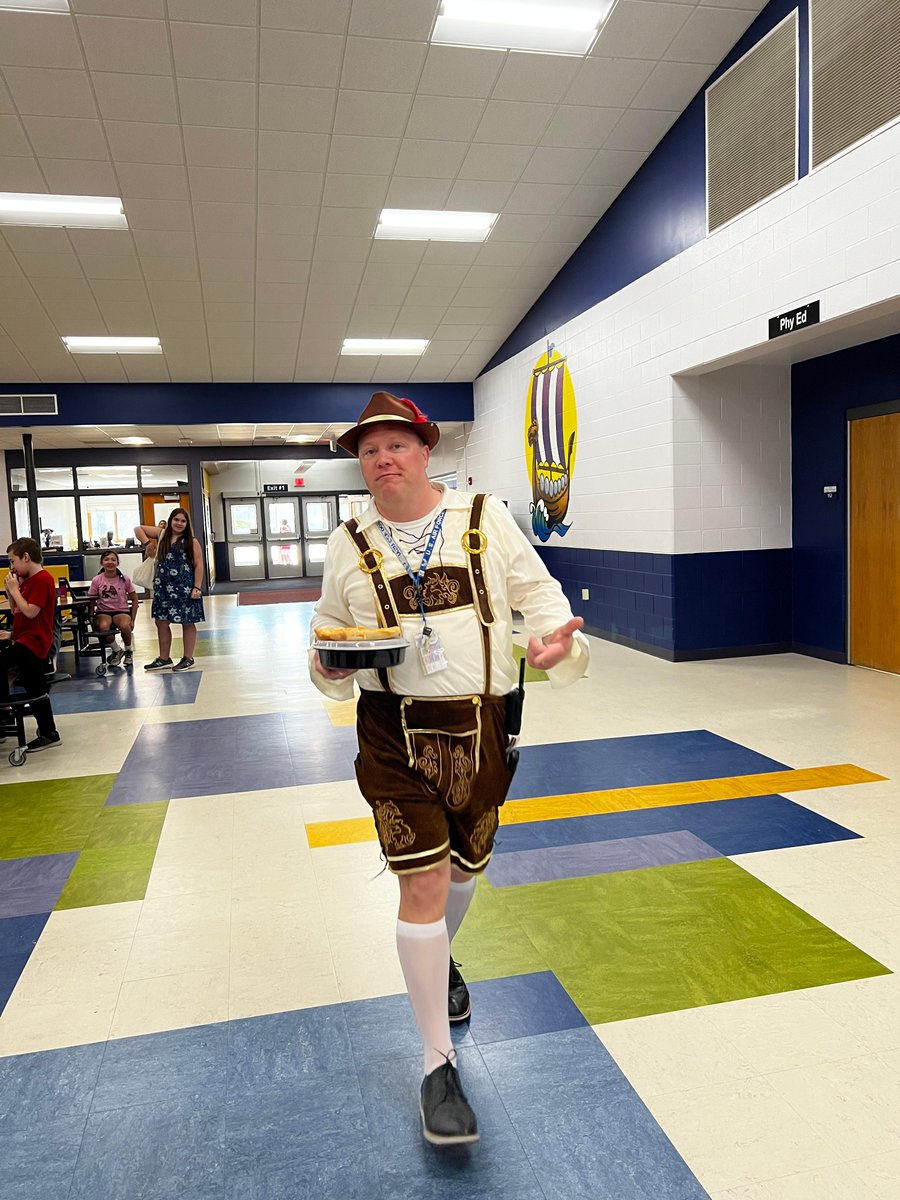WeAreStoughton's tweet photo. 🦅It's a bird! It's a plane! No... it's @PrincipalNJonesJones dressed in a Lederhosen, working from the roof, as a reward for RB students meeting the 'Keeping the Building Clean' goal!😆😆 https://t.co/AyVfX2eVOp