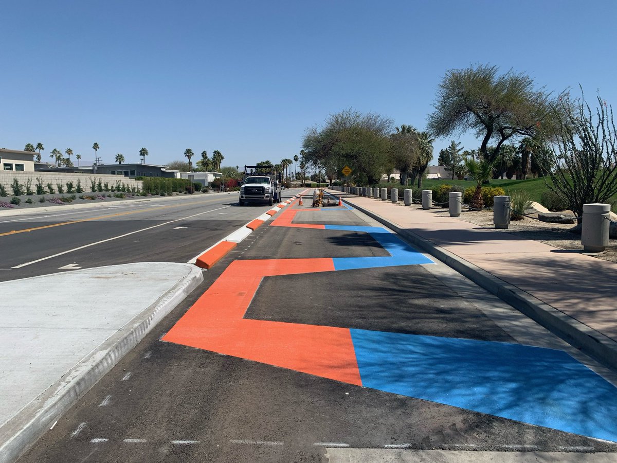 TheRCTC's tweet photo. 🏗️ It’s been one year since the #CVLink Demuth Park Access Point broke ground. Since then, construction crews have poured the signature orange/blue glass banding & concrete & installed shade structures to keep visitors cool.🚶♂️🚴♀️
@CV_Link @CVAGnews @CityofPS
#CoachellaValley https://t.co/dssQfLvLrs