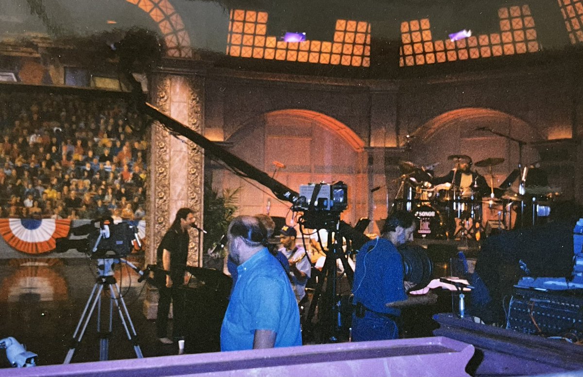 MatGurman's tweet photo. This was taken at the Tonight Show in the mid 90’s.  I was singing on some pre record Skits.  I used to do quite a few of these sessions back then.  I can see Keven Eubanks, Bob Hurst and Jeff Tain Watts in this picture and the back of the late great Kenny Kirkland. https://t.co/5PugWOZB5V