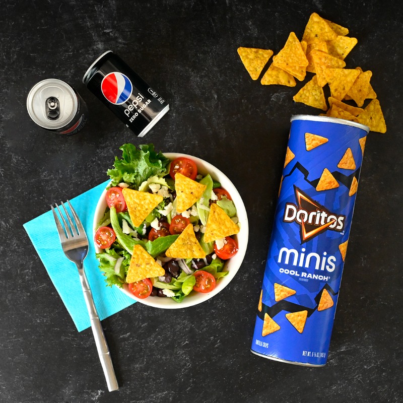 PepsiCo's tweet photo. Sprinkled on a salad, stuffed in a sandwich, or straight out of the can: what’s your favorite way to enjoy @Doritos minis? https://t.co/2L2oHZJJS5