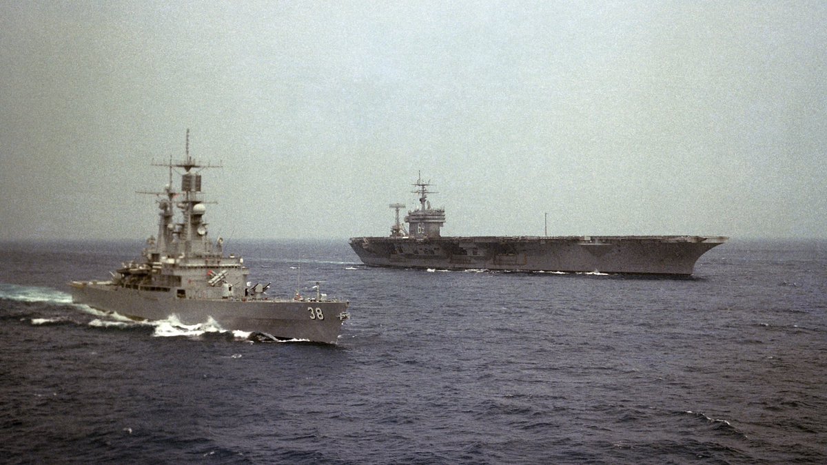 A look back at USS Virginia CGN-38 (1982) underway with USS Dwight D Eisenhower CVN-69 in the background.  Note the dual quad harpoon launchers under the bridge, also CWIS had not been installed yet on either ship. #ussvirginia #cgn38 #ike #cvn69 #usseisenhower #harpoon #cwis