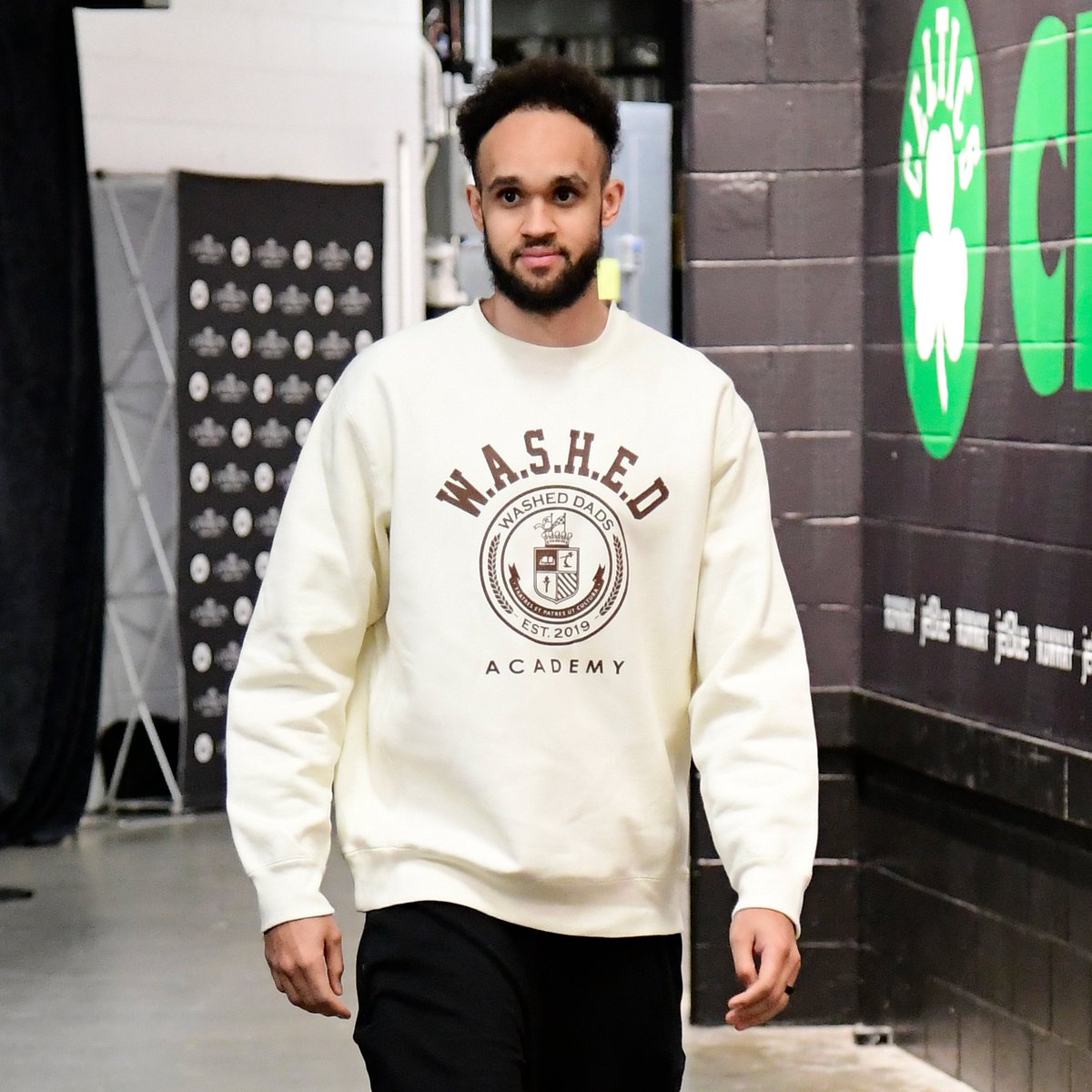 Derrick White says the "W.A.S.H.E.D." on his sweatshirt stands for "We Are Super Heroes Every Day" and is dedicated to all the dads out there.