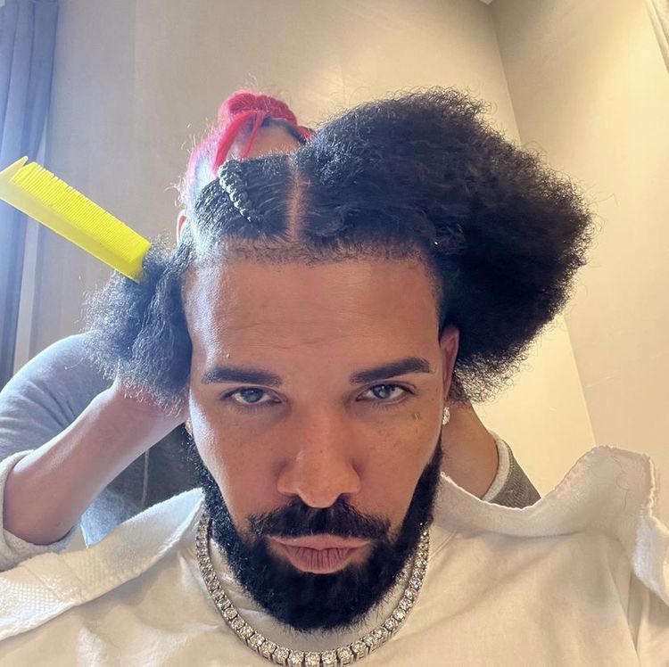 Me looking through my phone while getting my hair done :