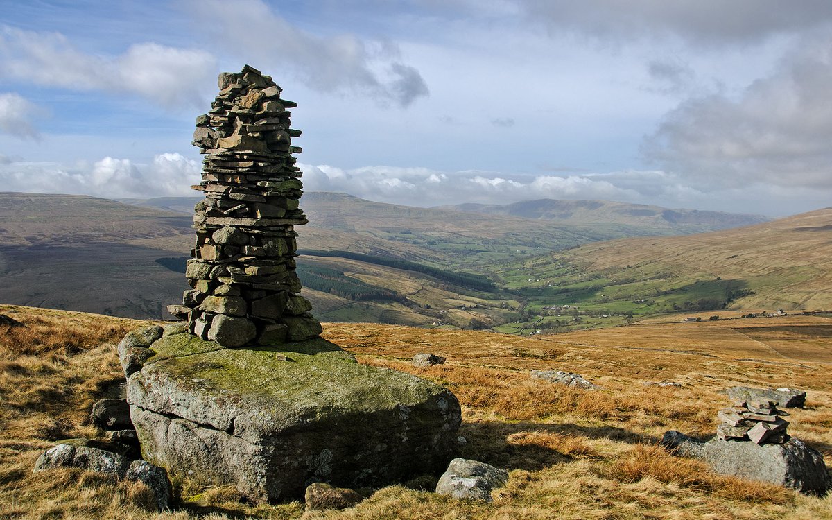 Cairn on Great Knoutberry Hill, looking down Dentdale in the Yorkshire Dales.
