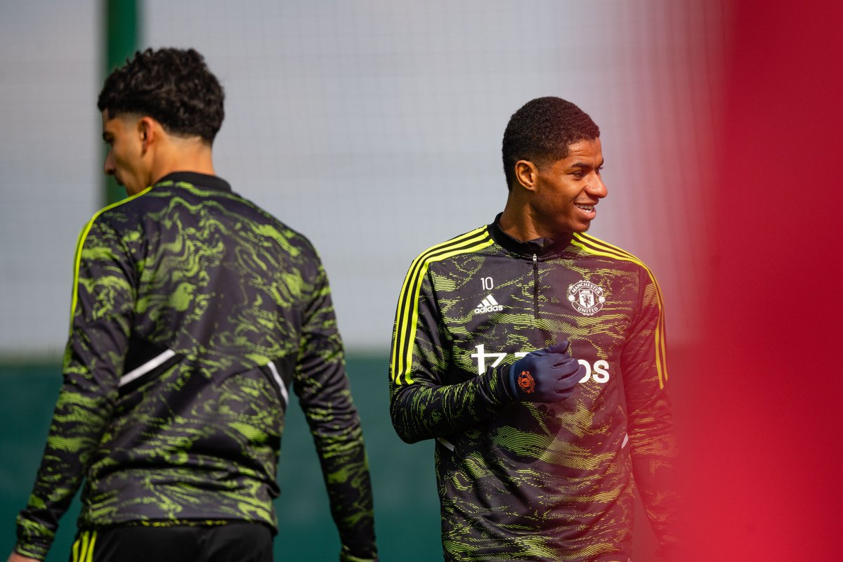 Marcus Rashford smiles at Carrington.