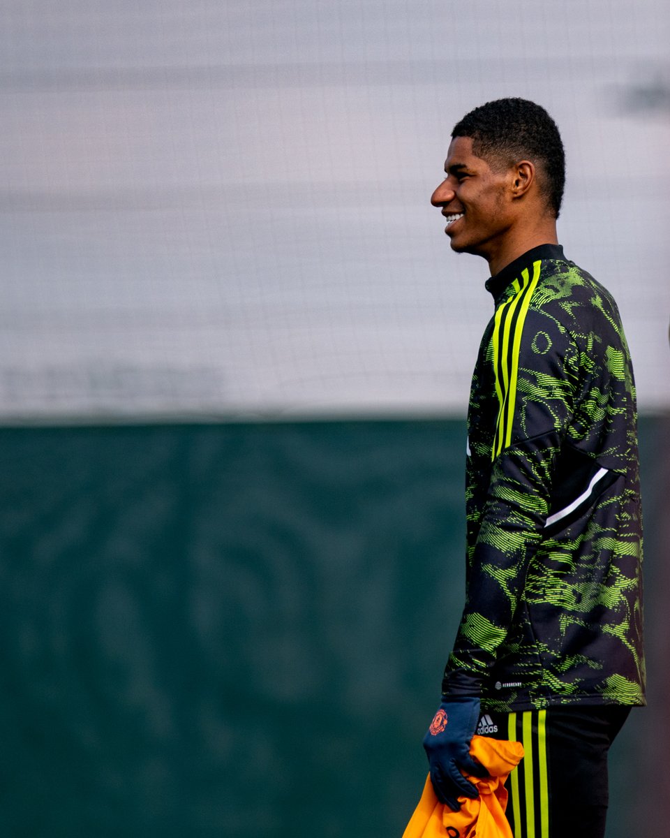 Marcus Rashford smiles at Carrington.