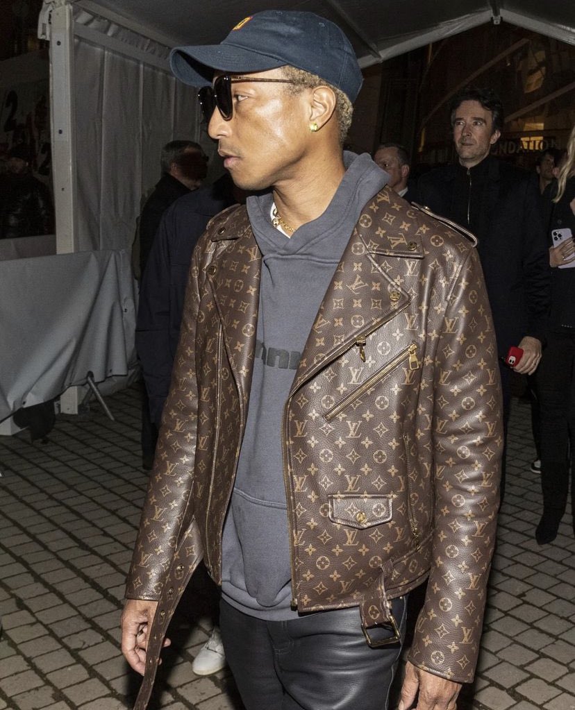 Pharrell in Paris wearing a full Louis Vuitton monogram biker jacket Photo:  T. Da Silva, P. Perusseau/ Bestimage