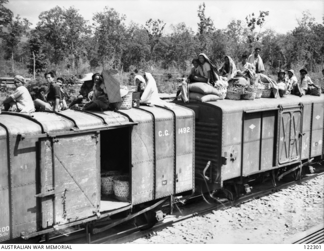 Wampo (Now: Wang Po /วังโพ), #kanchanaburi , 1945. Asian natives sitting on the roof of a truck on a stretch of #burmathairailway Trucks identical to these were used to transport POWs from Singapore to Thailand @AWMemorial awm.gov.au/collection/C47…