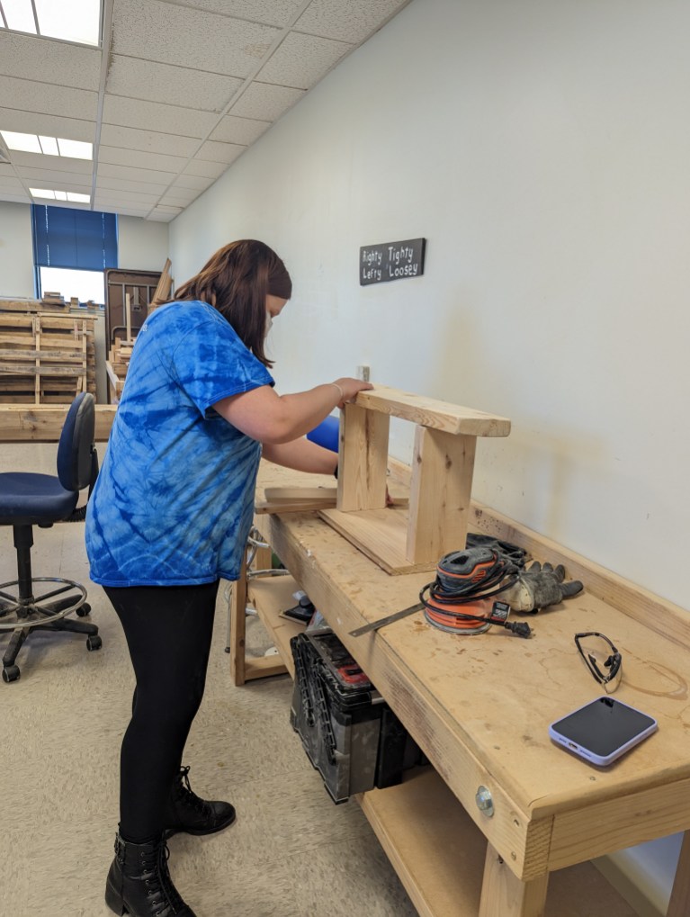 TheIrisNetwork1's tweet photo. Haley is preparing to build a birdhouse in our Manual Arts room. Manual arts, like woodworking, can help people with vision loss develop crucial organizational skills and systematic approaches to manual tasks. #ManualArts #VisionWithNoLimits #VisionImpairment #Blindness https://t.co/hNb99FQxfJ