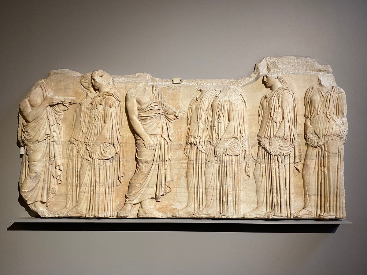 SOARarchaeology's tweet photo. For #ReliefWednesday, a fragment from the east frieze of the Parthenon Marbles, depicting the Panatheanic festival, also known as the 'Ergastines Panel'. This panel shows six young women bringing the instruments used in worship to two men in charge of the ceremony. https://t.co/9MspnAdNYo