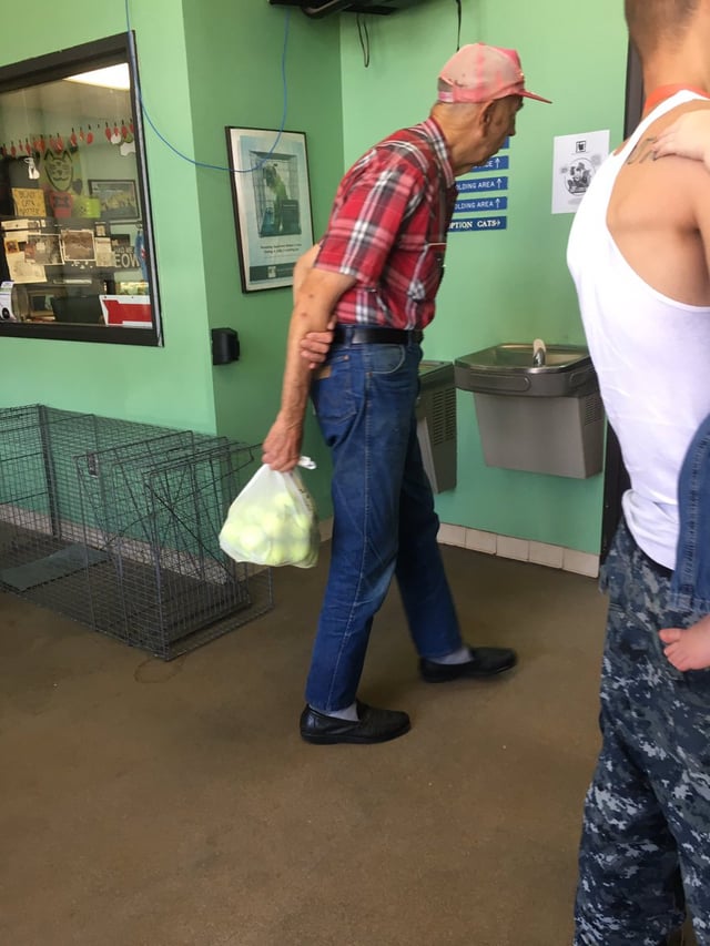 This old man is donating tennis balls to the animal shelter