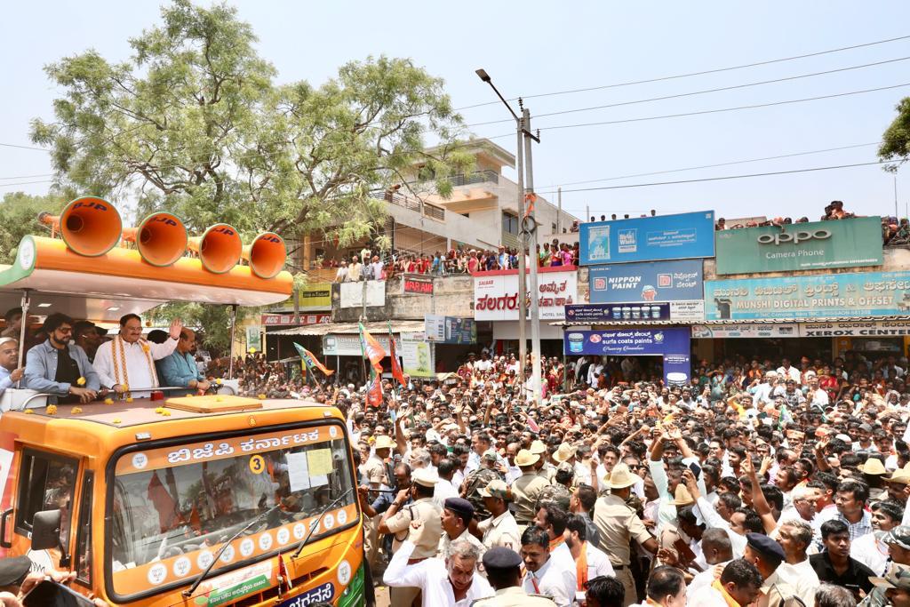 Tejasvi_Surya's tweet photo. Sri @JPNadda, BJP National President, participated in a road show in Haveri along with CM Sri @BSBommai today.

People of Haveri are backing @BJP4Karnataka to form Govt with thumping majority.

#BJPYeBharavase https://t.co/a9ywR8Hibs