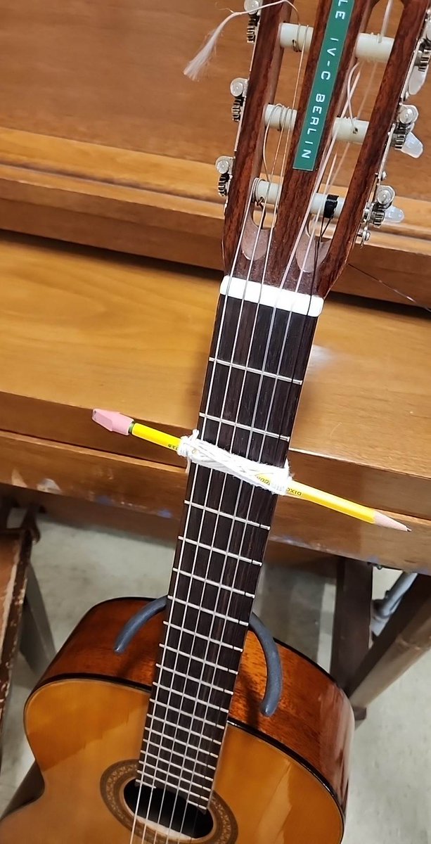 Nazerithe's tweet photo. My guitar student forgot her capo. So I gave her a pencil and string and said make one. It plays better than most capos I have used ... https://t.co/aQb7E97qib