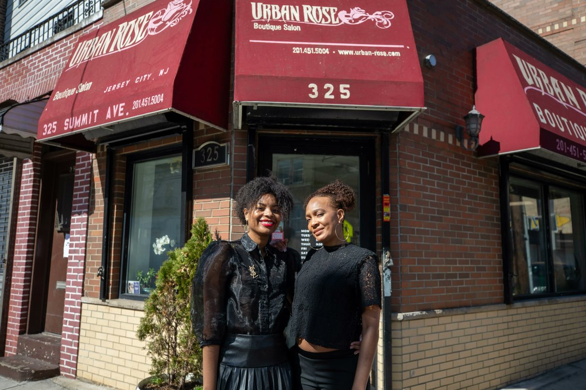 JerseyCity's tweet photo. .@Urbanrosesalon mom-daughter team Patricia Bissouta, right, & Rocia Kanza pose in front of the salon at 325 Summit Ave. Patricia learned hairstyling from the previous owner who opened in 2009. When the owner retired, Patrica took over the salon.
#JCstorefronts https://t.co/QNeuFjNt2d