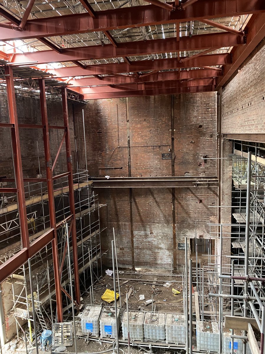 Bradford_Live's tweet photo. Scaffolding being taken down in the fly tower.  Massive new steel structure supports the new roof and forms a grid to mount major lighting arrays for big shows. This has been one of the biggest construction challenges of the whole build. Nice to see it revealed today! https://t.co/lyRCvBv73C