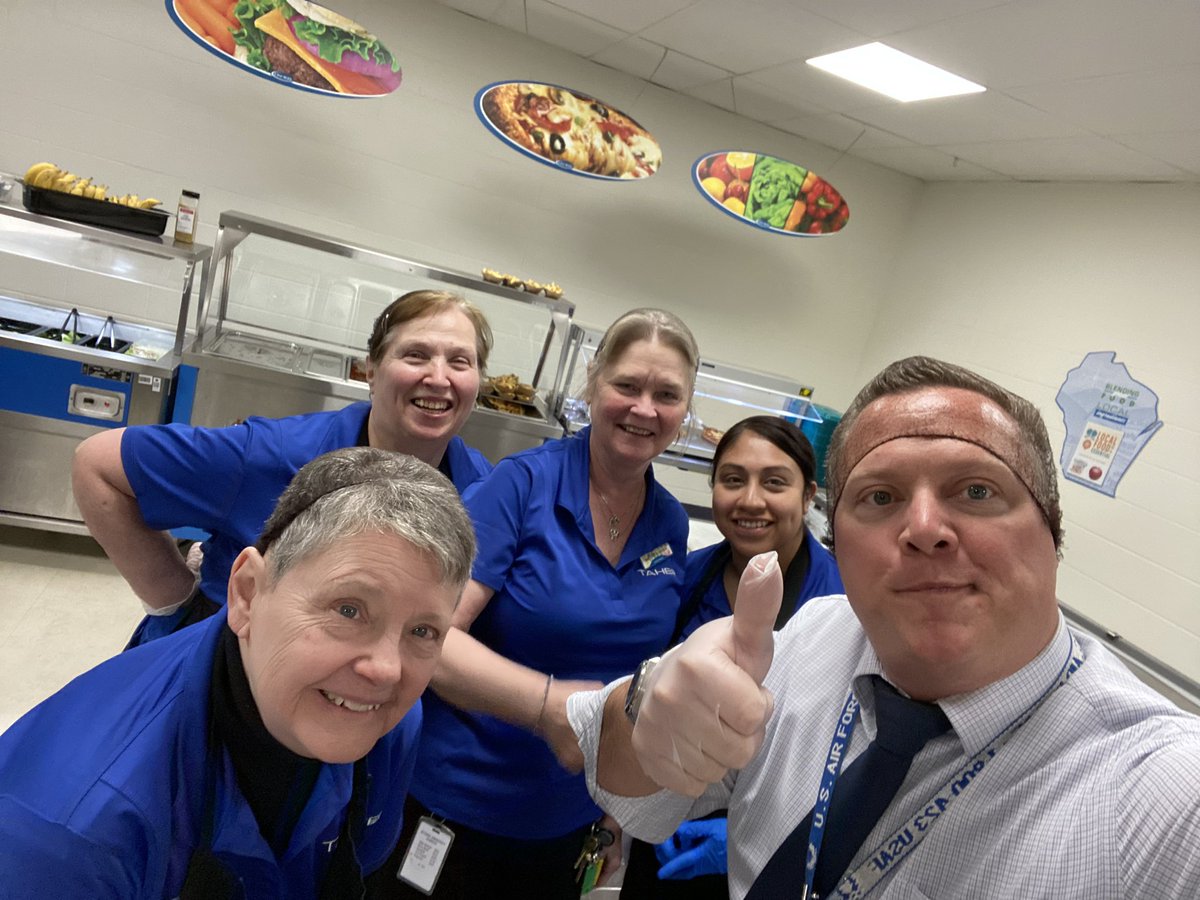 PrincipalNJones's tweet photo. Sometimes Mr Jones get bored filling out Google Docs so the ladies offered to train me on the chow line! @WeAreStoughton https://t.co/j7kcAii3qt