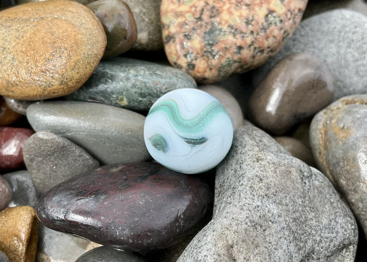 ~ Take a look at this truly unique sea marble I just recovered off the shorelines which I believe is a Pre-WW2 “Ravenswood” marble! 
#beachcombing #seaglassarchaeology #capebreton #seaglass #mermaidstears #Beachcombing #mudlarking #beachglass #seamarble