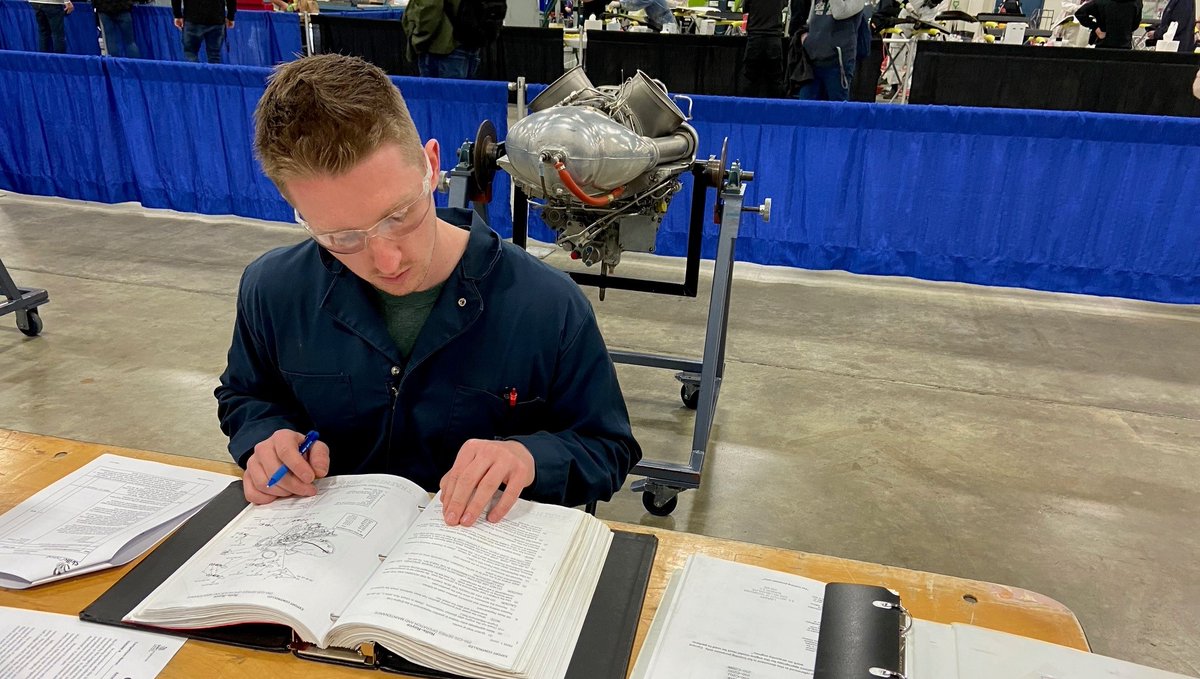 Only a few hours left in today's #Aerospace (PS) @SkillsBC Provincial Competition and @okanagancollege competitor, Bryce, is laser focused on the competition's diagram. Good luck, Bryce! You've go this! #SCNC2023 #skilledtrades #skillsbc