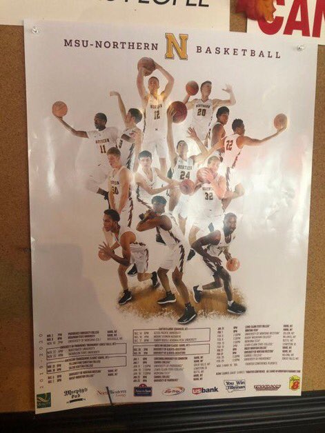 Taking a charge on media day for the team poster