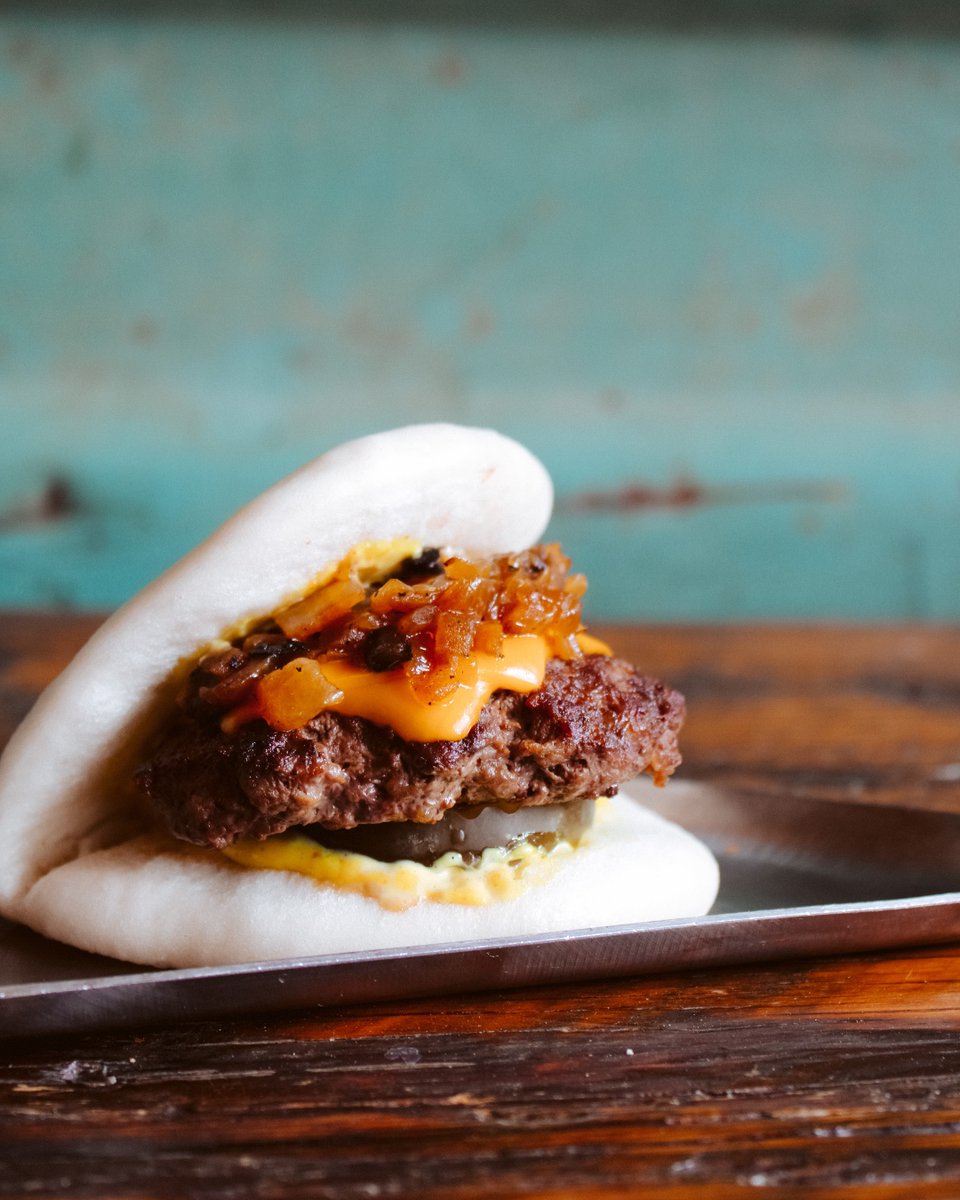Hey the munchies called! They want this White Pagoda Bao. 
. 
House-made bao bun stuffed with a ground beef patty, American cheese, curry aioli, caramelized onion, and pickle.
.
Available on 4/20 only! Get it while supplies last!